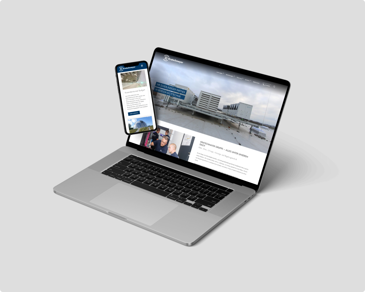Mockup der kratschmayer Website auf einem Smartphone und Laptop